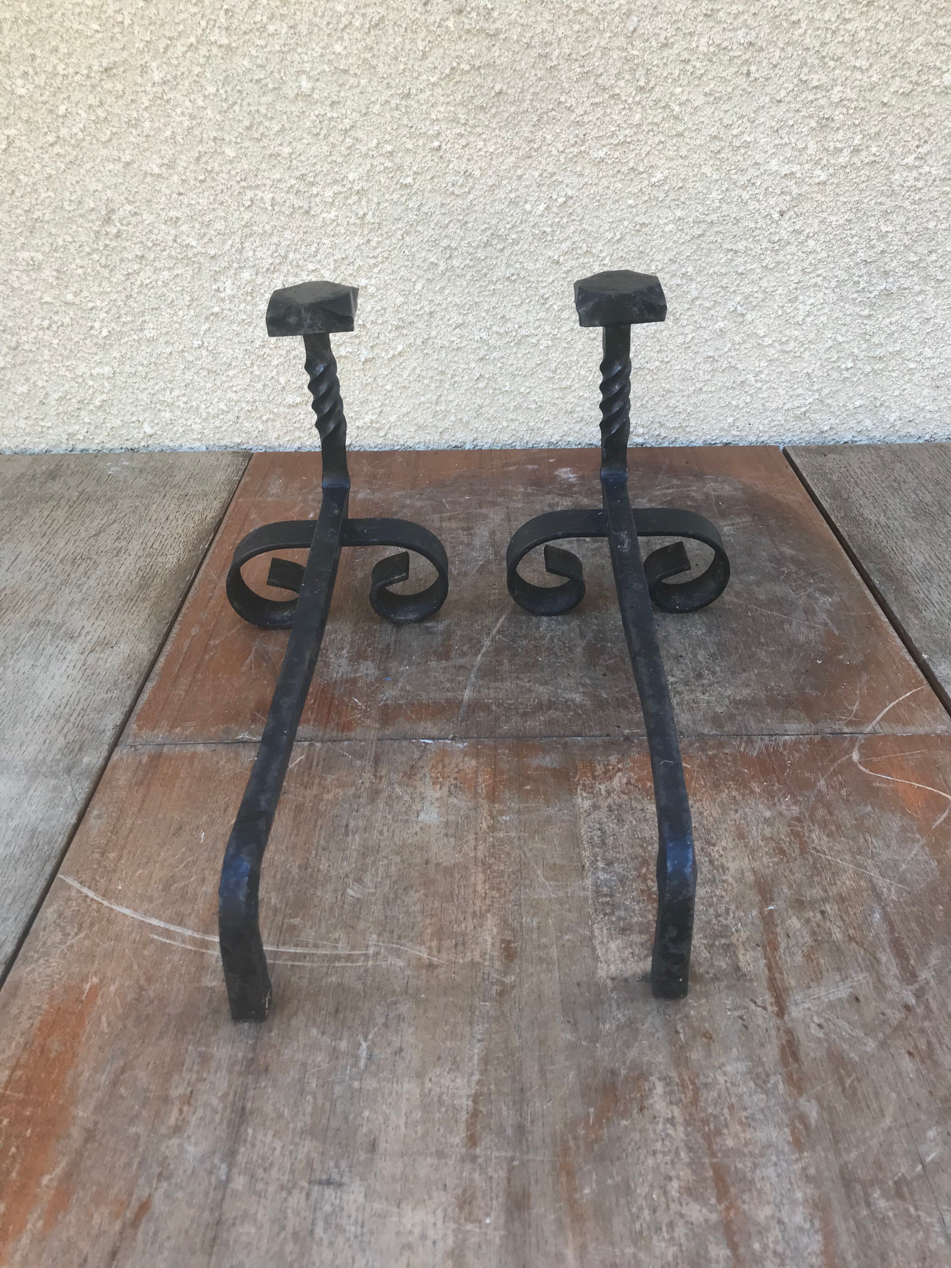 Old pair of twisted wrought iron andirons