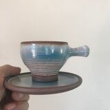 Lot 7 cups and saucers sandstone by Roger Jacques