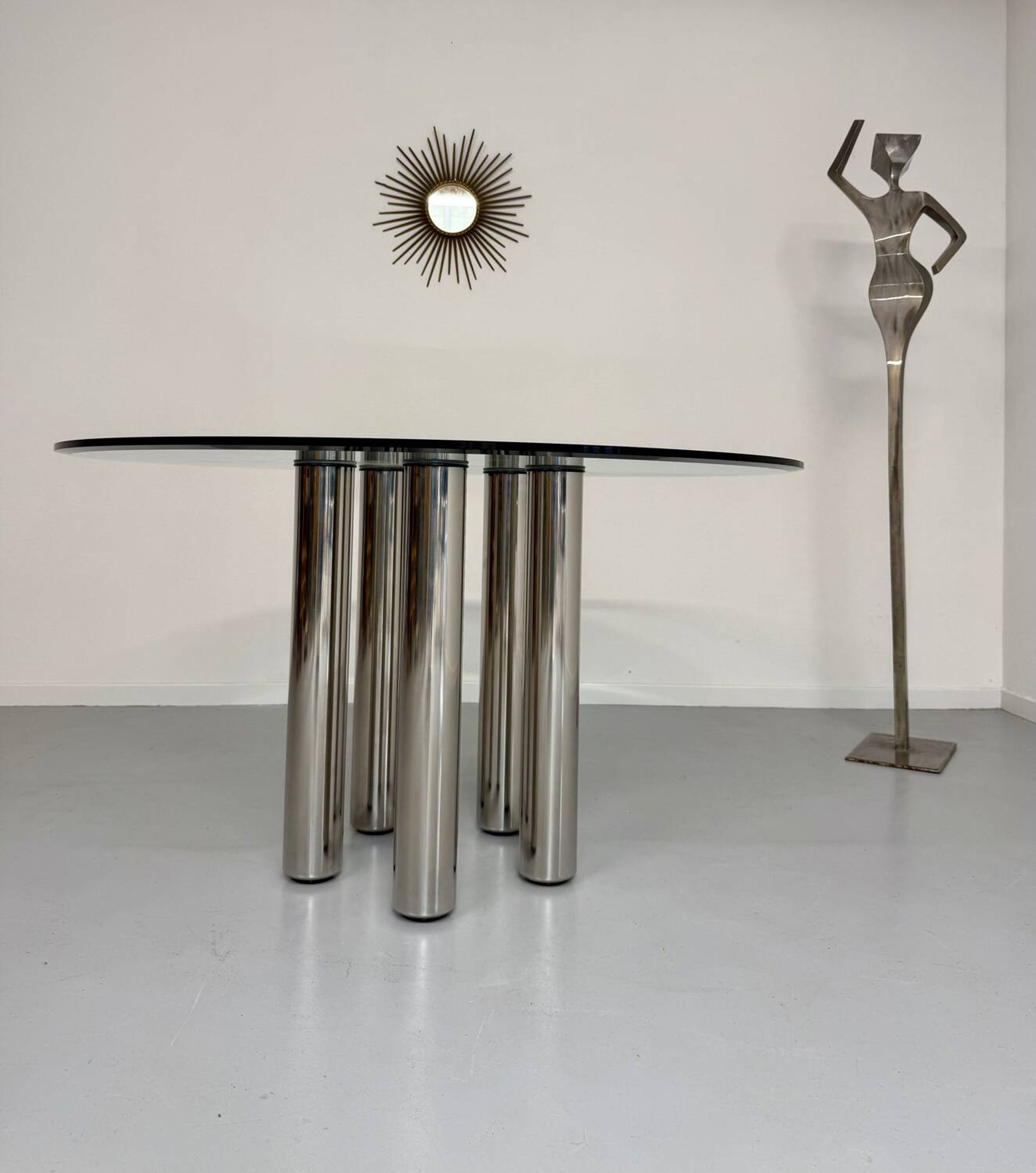Round glass and metal dining table, Italian design from the 80s, vintage