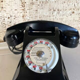 Black Bakelite phone with earphone