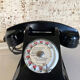 Black Bakelite phone with earphone