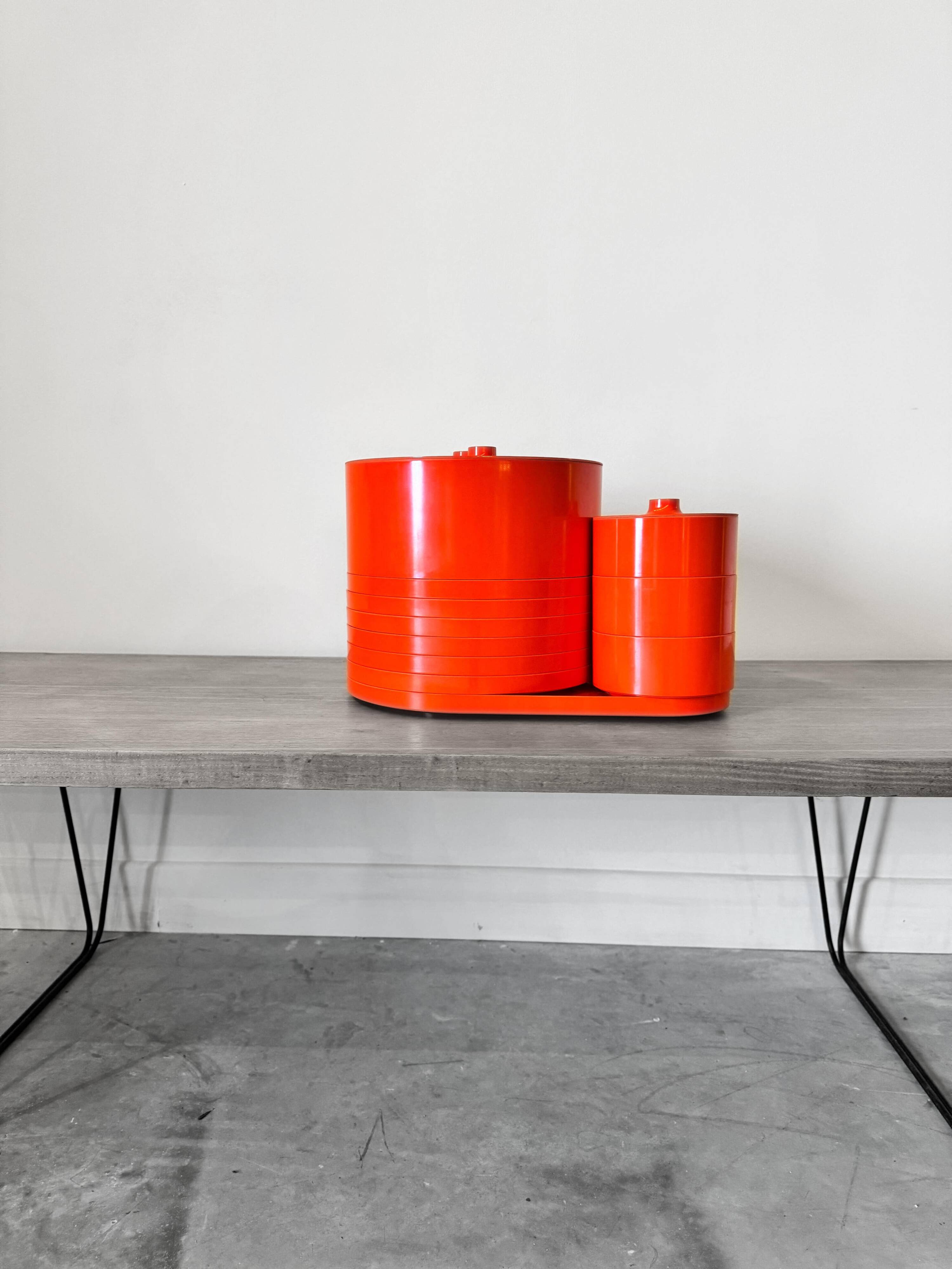 Vintage “Max” orange plastic dinnerware set 1964