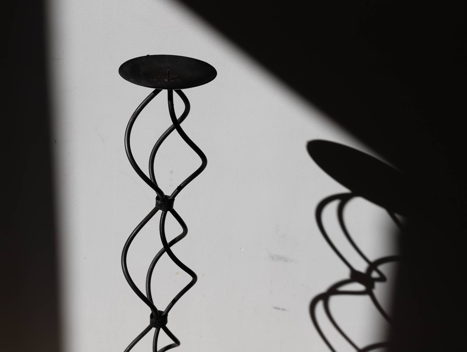 candlestick on wrought iron feet
