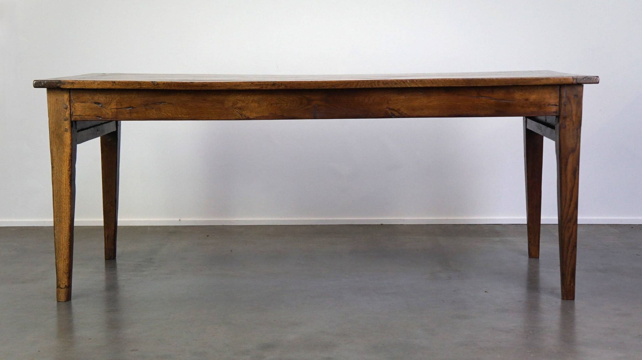 antique French oak dining table with 3 drawers and an exquisite patina