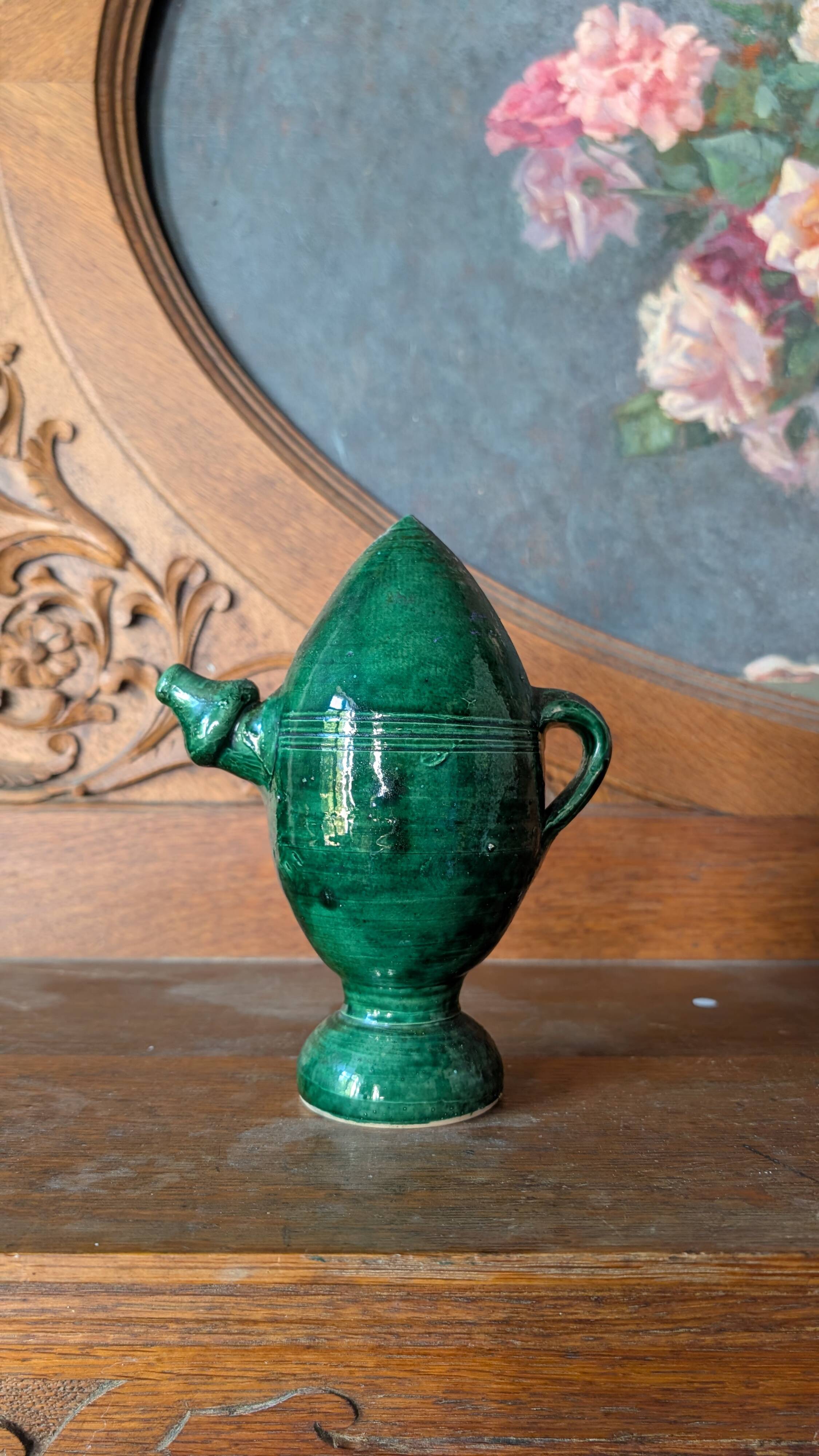 Decorative piece in green glazed stoneware, jug shape.
