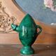 Decorative piece in green glazed stoneware, jug shape.