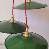 Trio of enameled sheet metal pendant lights