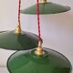Trio of enameled sheet metal pendant lights