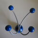 Grey metal wall hook, 4 wooden hangers