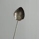 Vintage spoon in old metal, leaf pattern