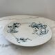 Flat earthenware plate with floral motifs