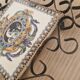 Hand painted gien tile on wrought iron trivet