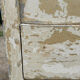 Small antique wardrobe with a faded white patina.