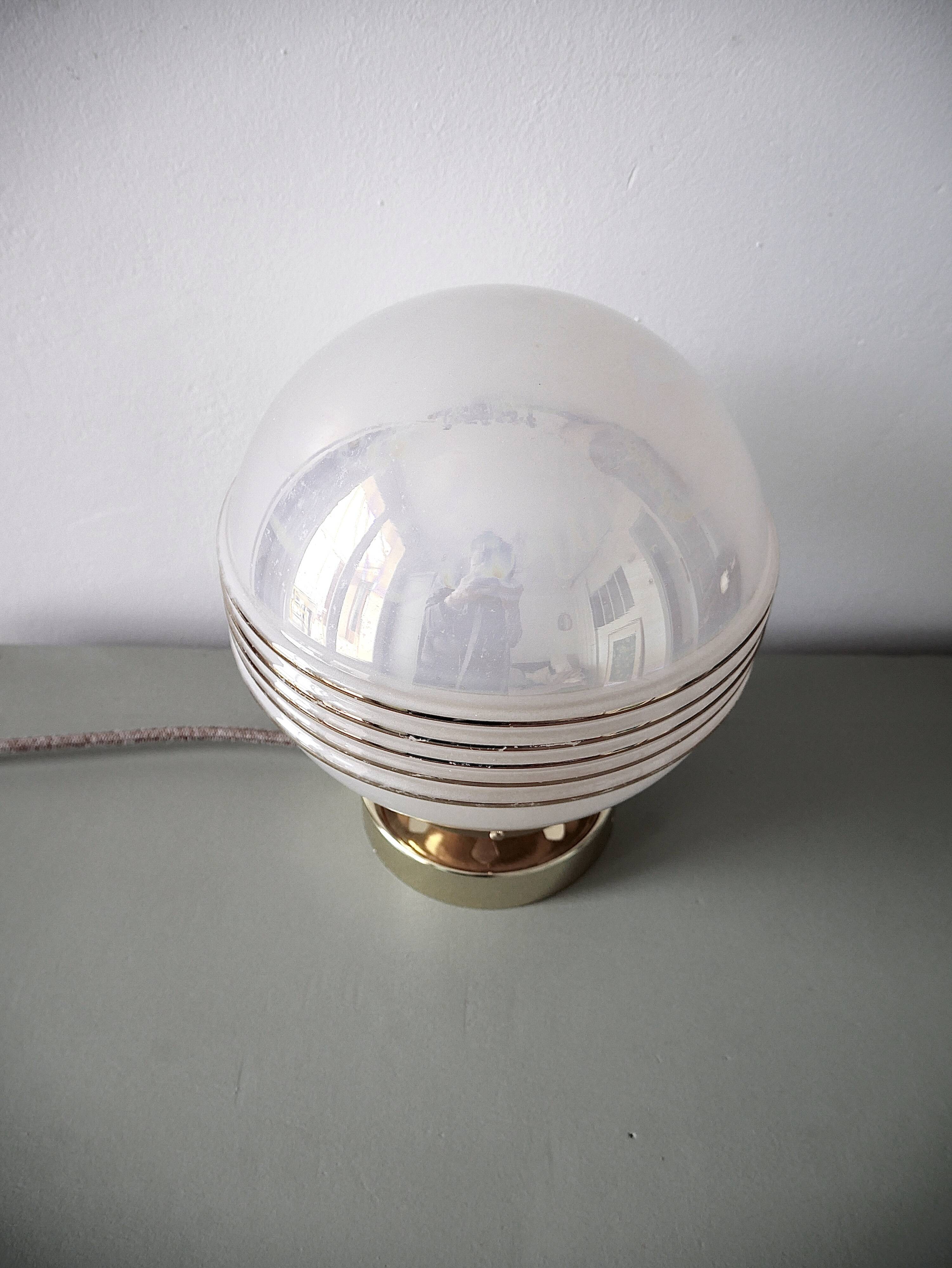 Pink iridescent glass lay lamp