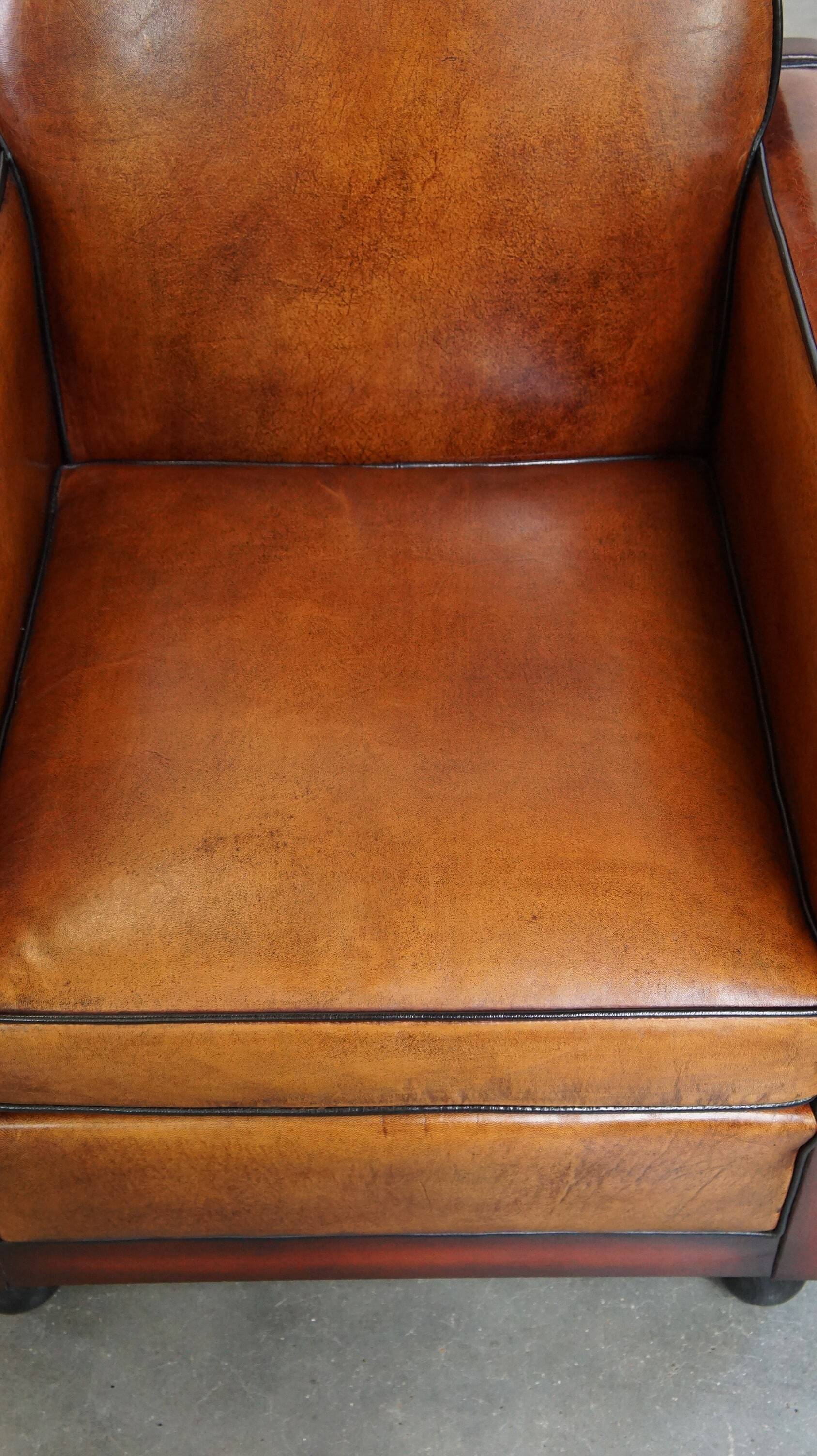 Cognac-colored sheepskin Art Deco design armchair in good condition