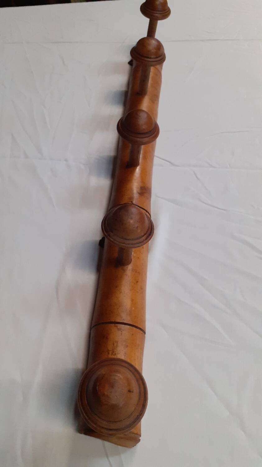 Wooden wall coat rack