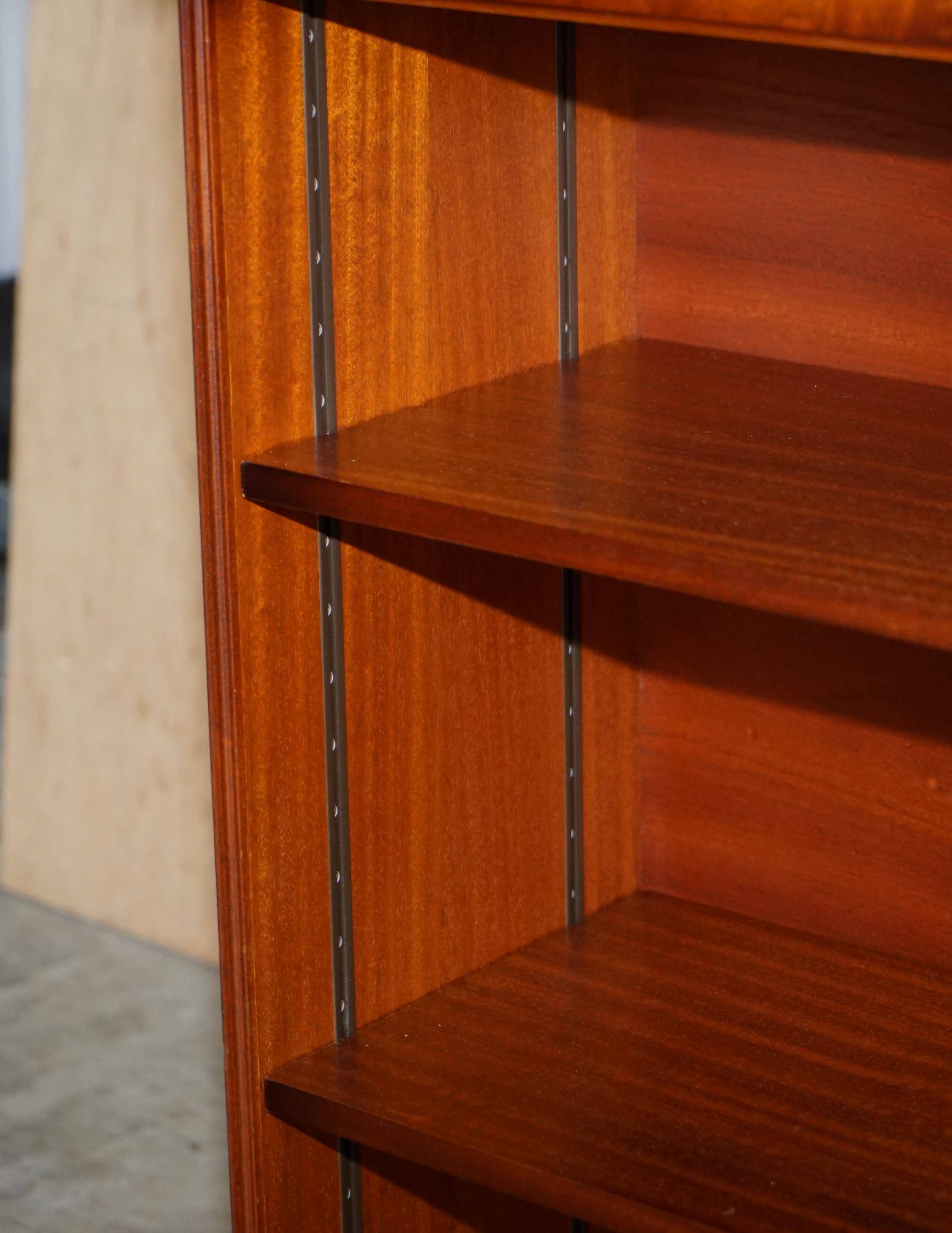 Pair of open dwarf bookshelves in mahogany by Shaws of London.