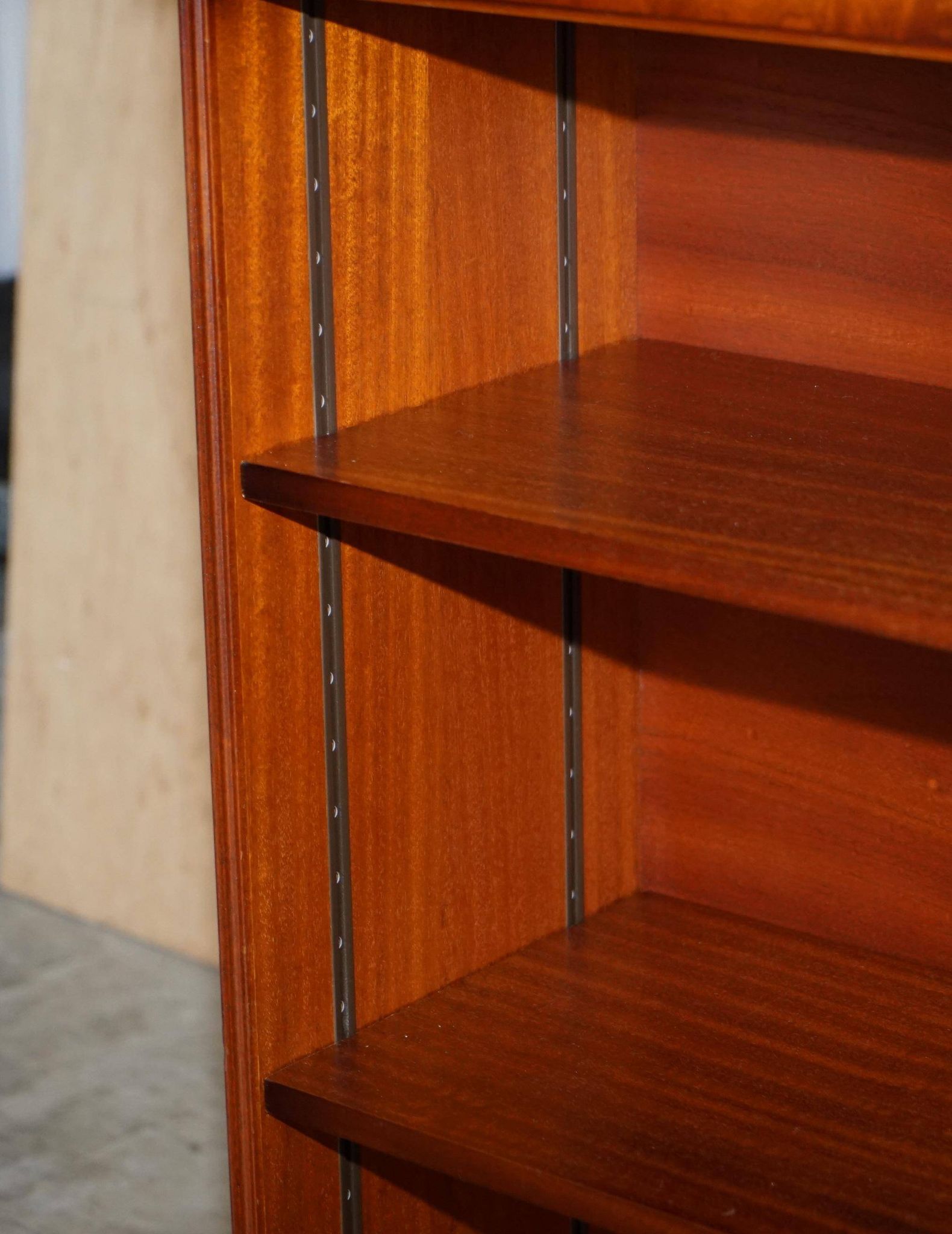 Pair of open dwarf bookshelves in mahogany by Shaws of London.
