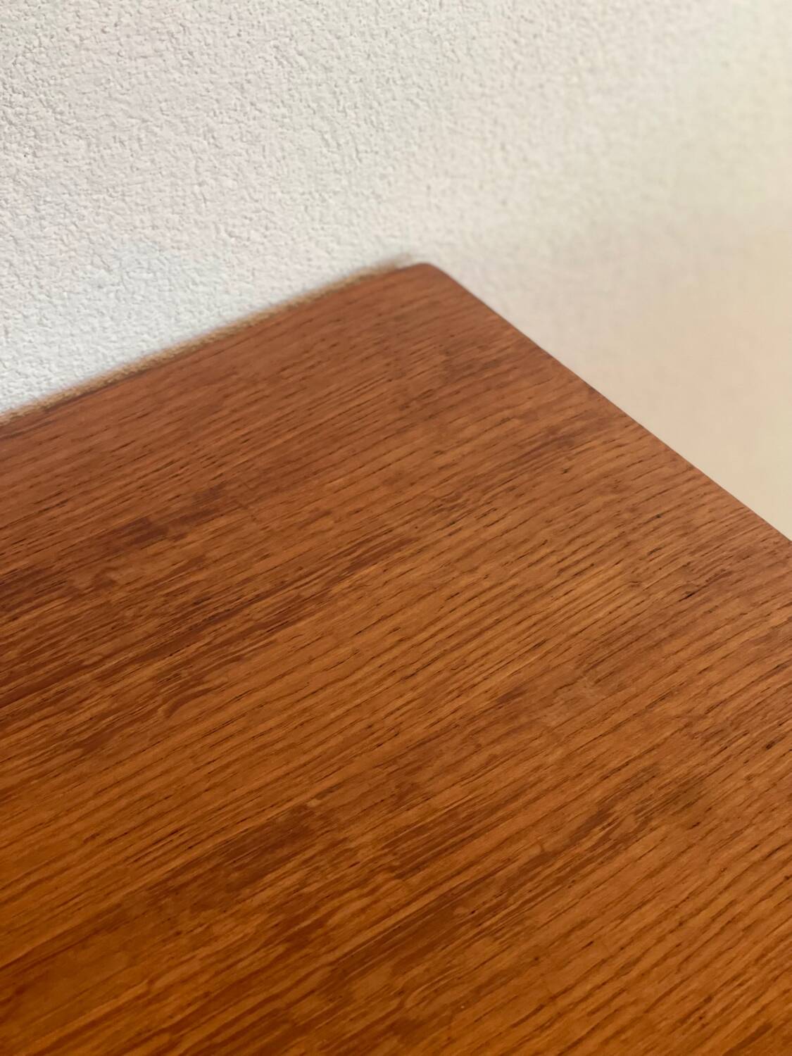 Vintage 1960s chest of drawers with covered handles.