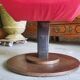 Old cinema chair with a red reclining seat.