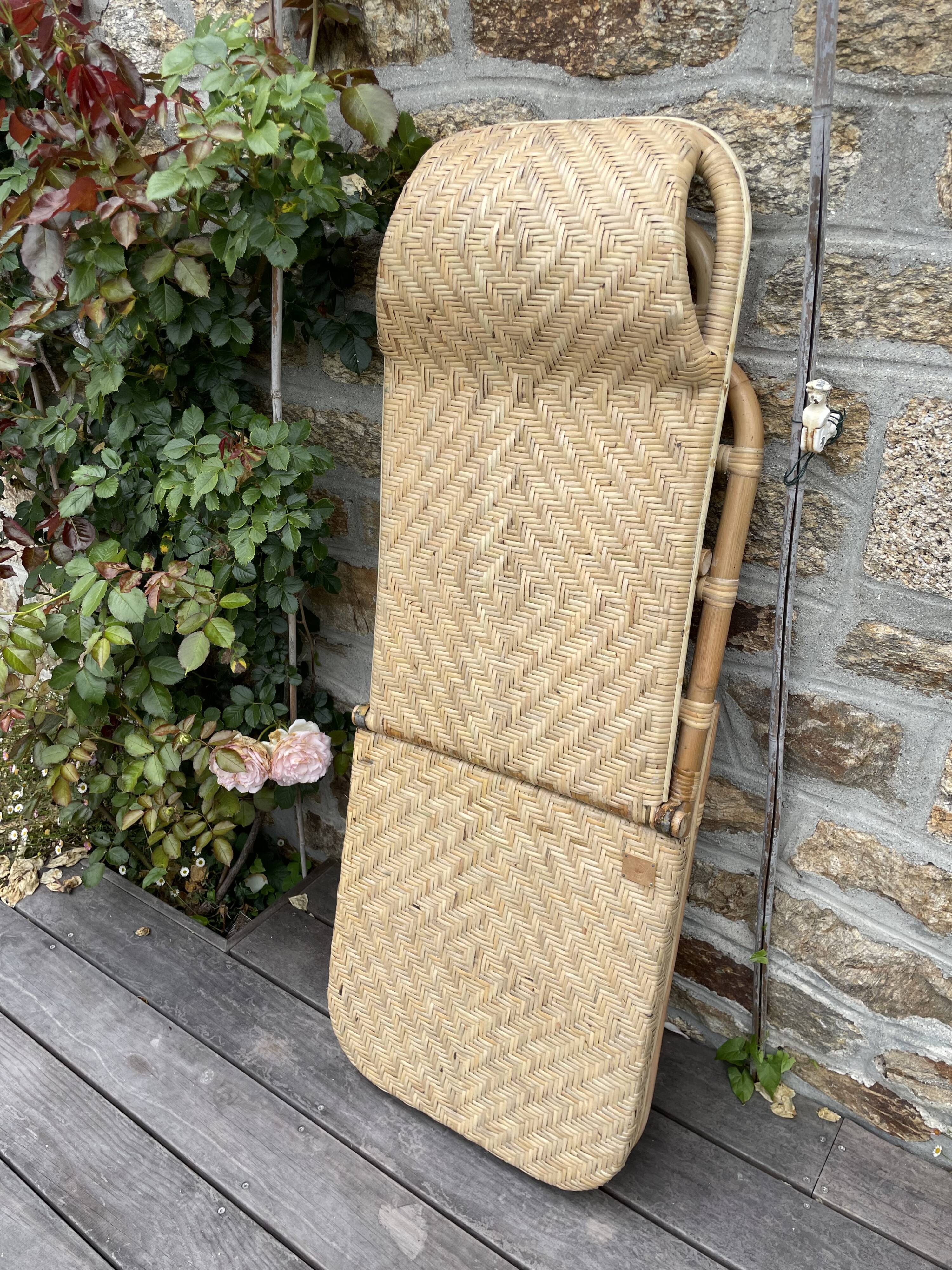 Two rattan garden chairs