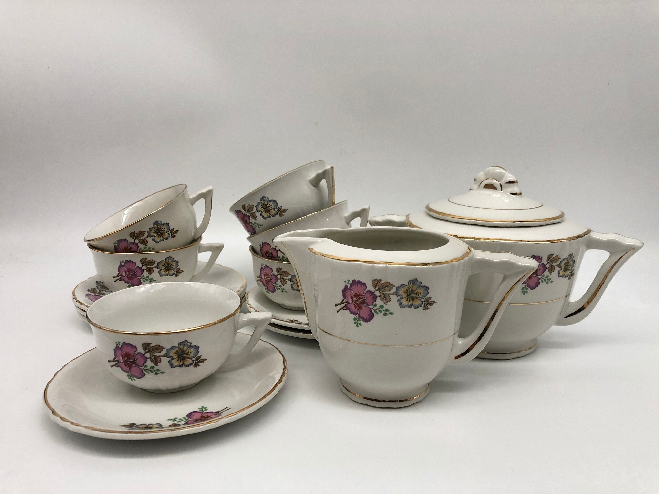 Coffee service 6 cups with saucers, sugar bowl and creamer.