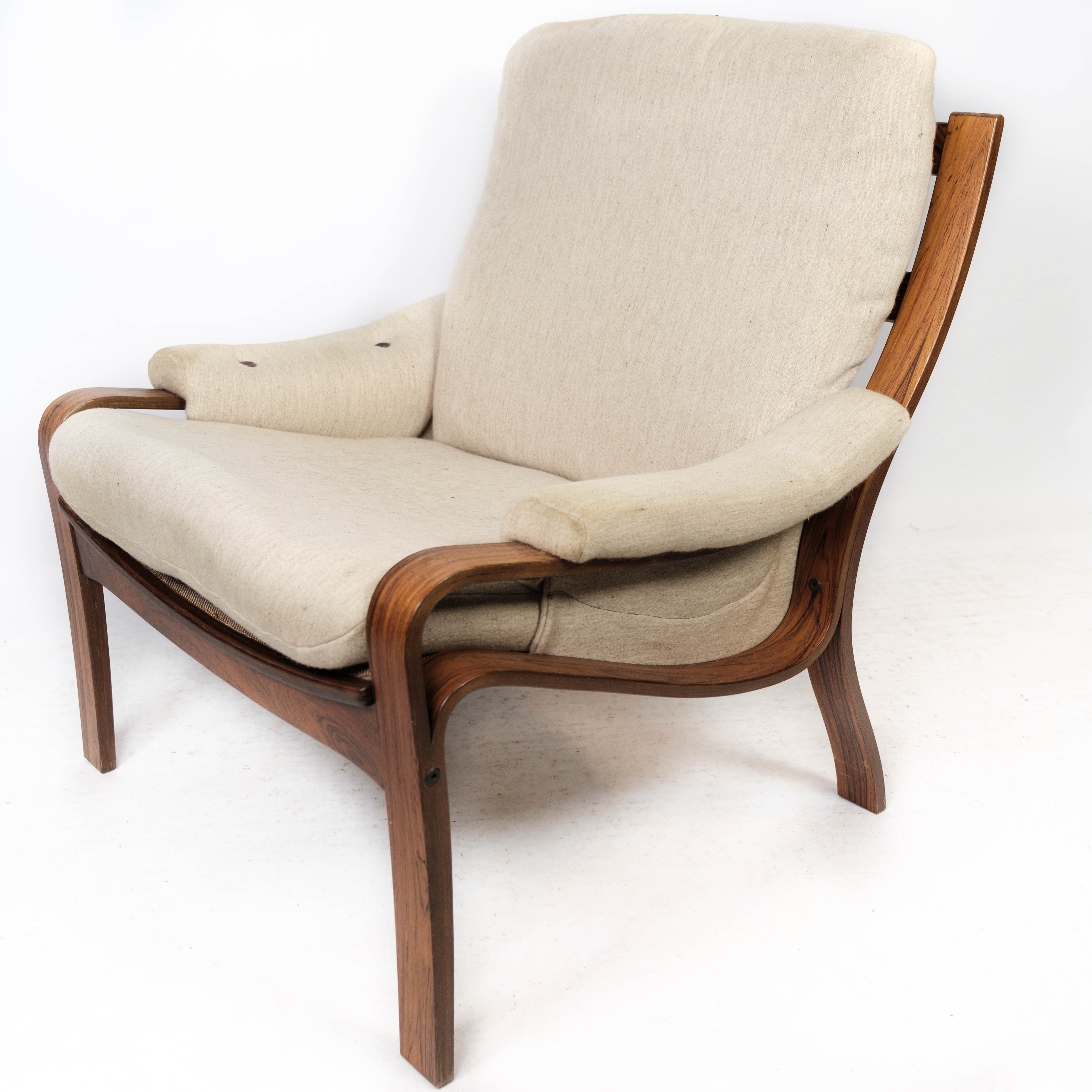 Armchair in rosewood and upholstered with light fabric, of Danish design, 1960s