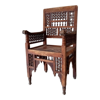 Moroccan armchair in carved wood early twentieth century