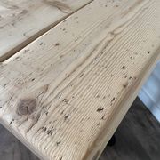 Bistro table with a central cast iron base in industrial style.
