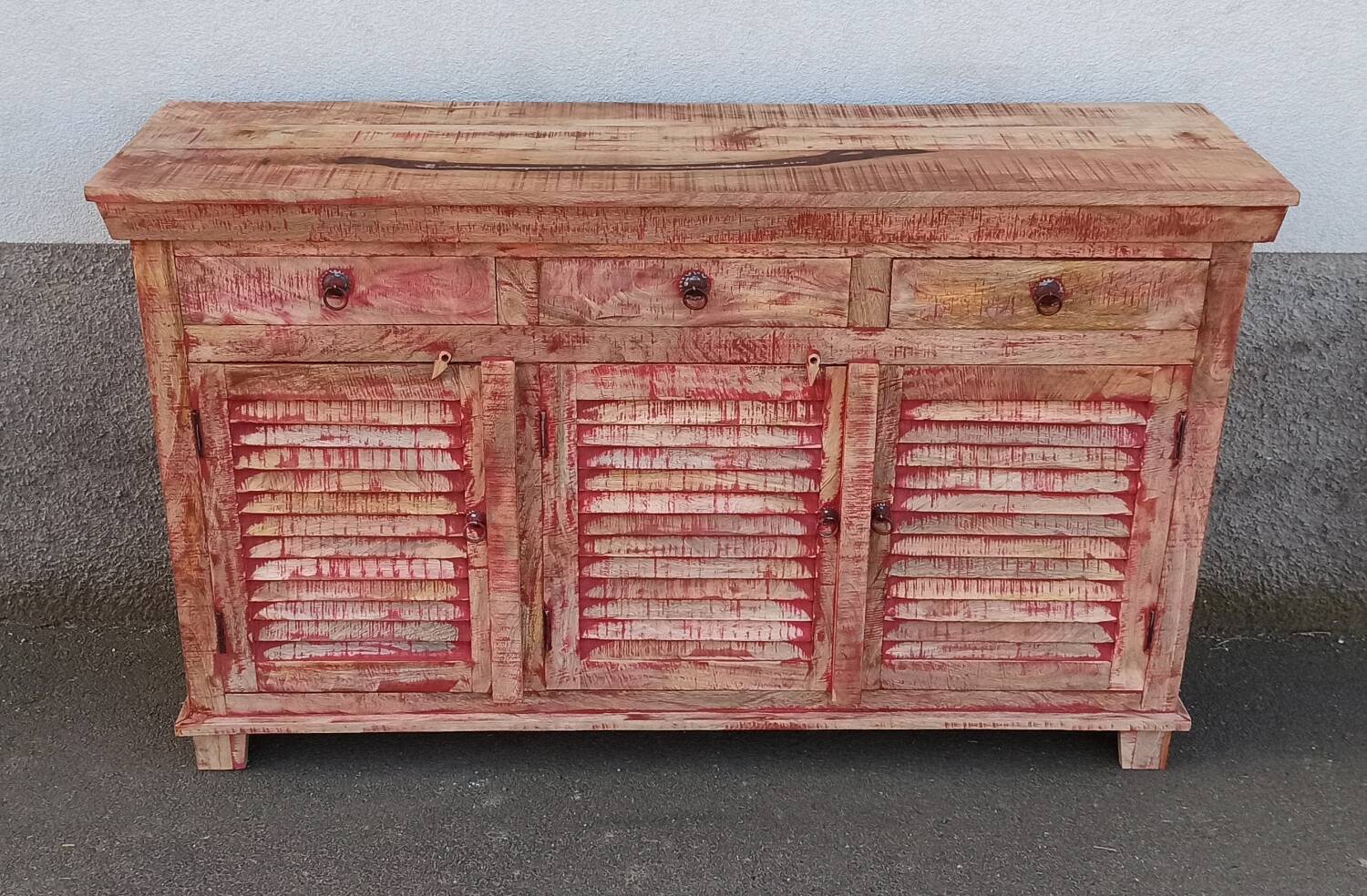 Wooden sideboard with red highlights