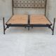 Double bed in burnished brass