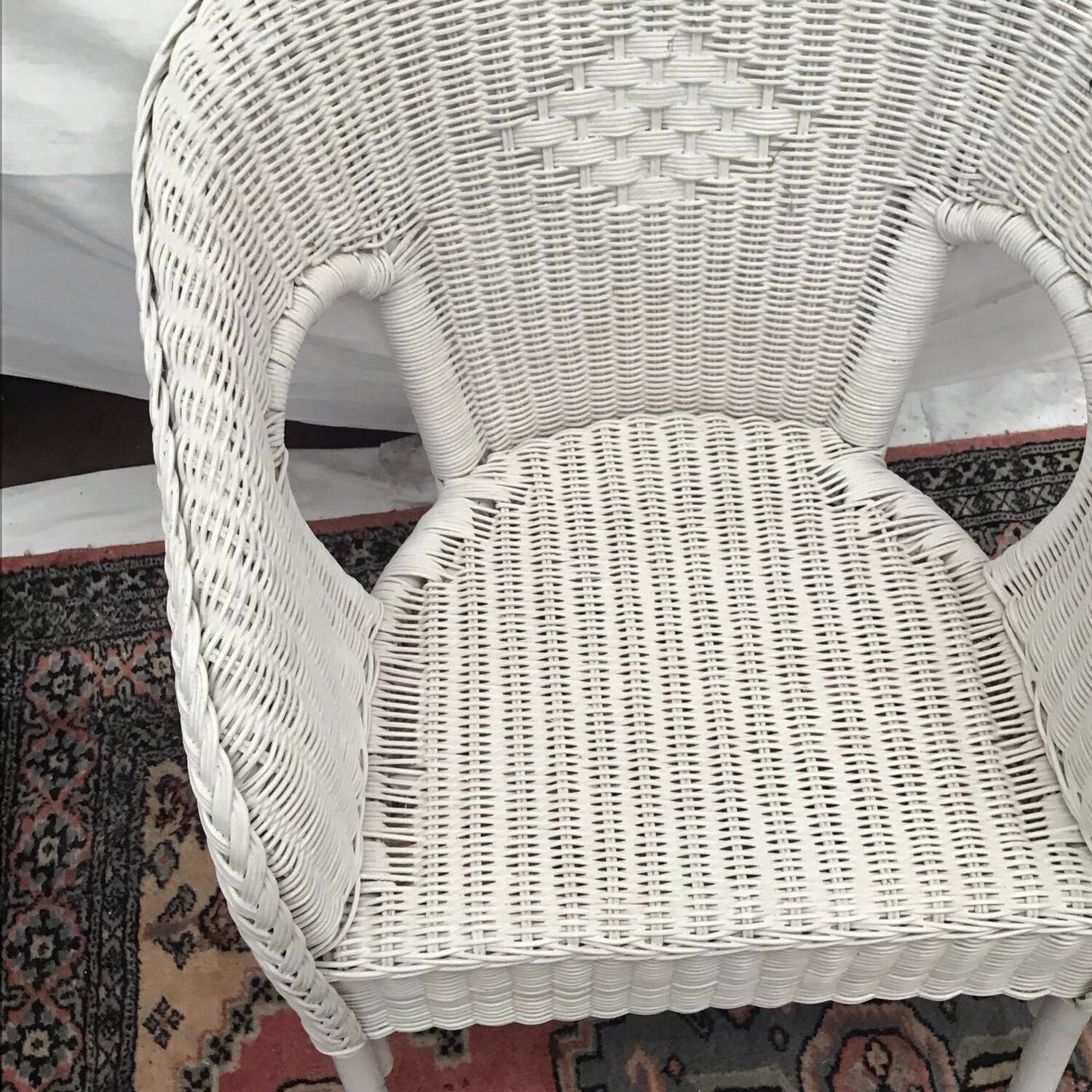 White rattan armchair with pretty vintage
