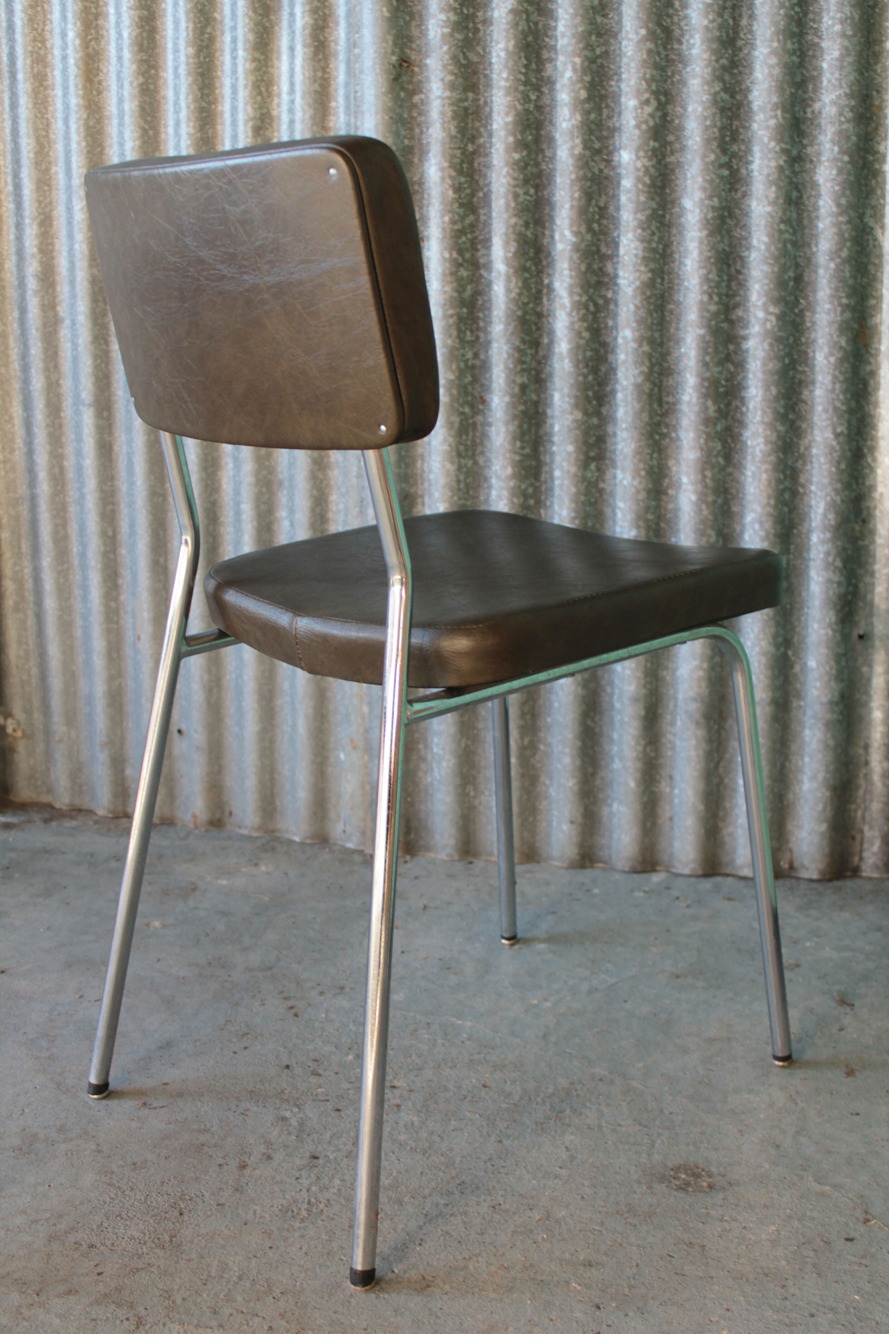 3 bronze-green faux leather chairs with chrome frames