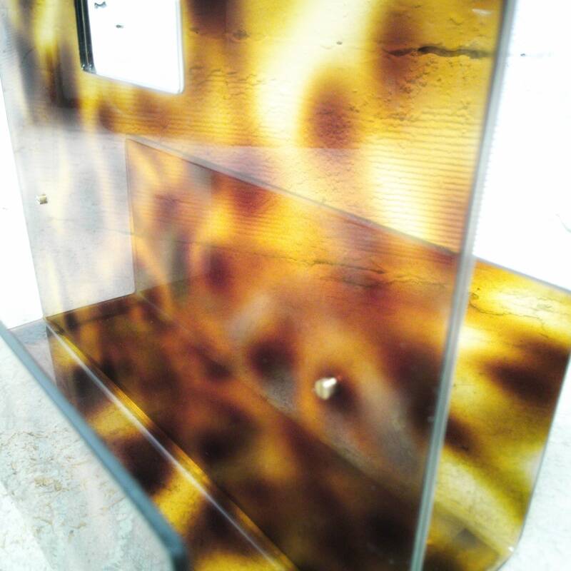 Vintage magazine rack in plexiglass and brass