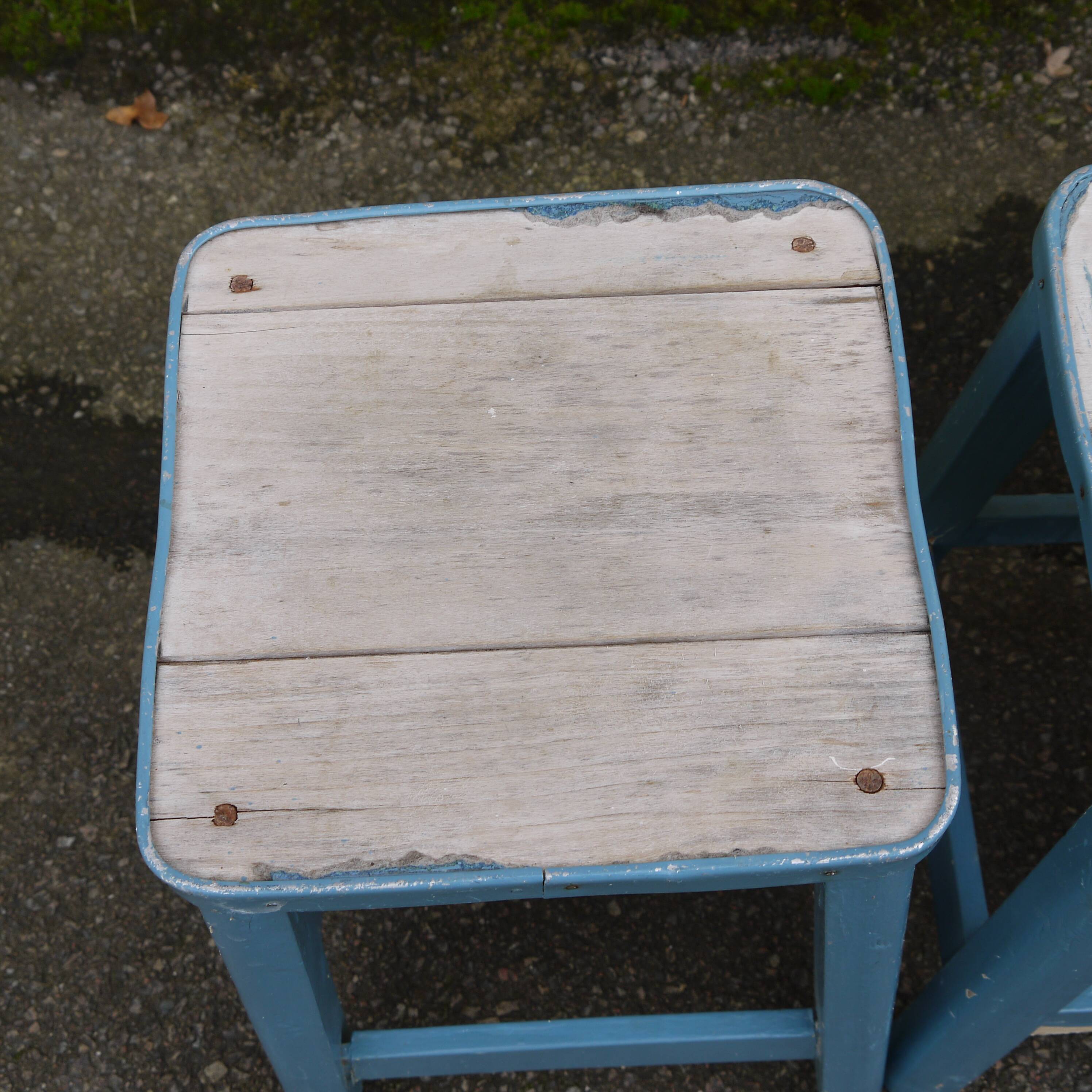 Three blue wooden stools