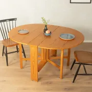 Practical folding table from the 1980s made of light brown pine wood