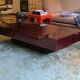 Burgundy lacquered coffee table with brass by Jean-Claude Mahey.
