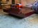Burgundy lacquered coffee table with brass by Jean-Claude Mahey.