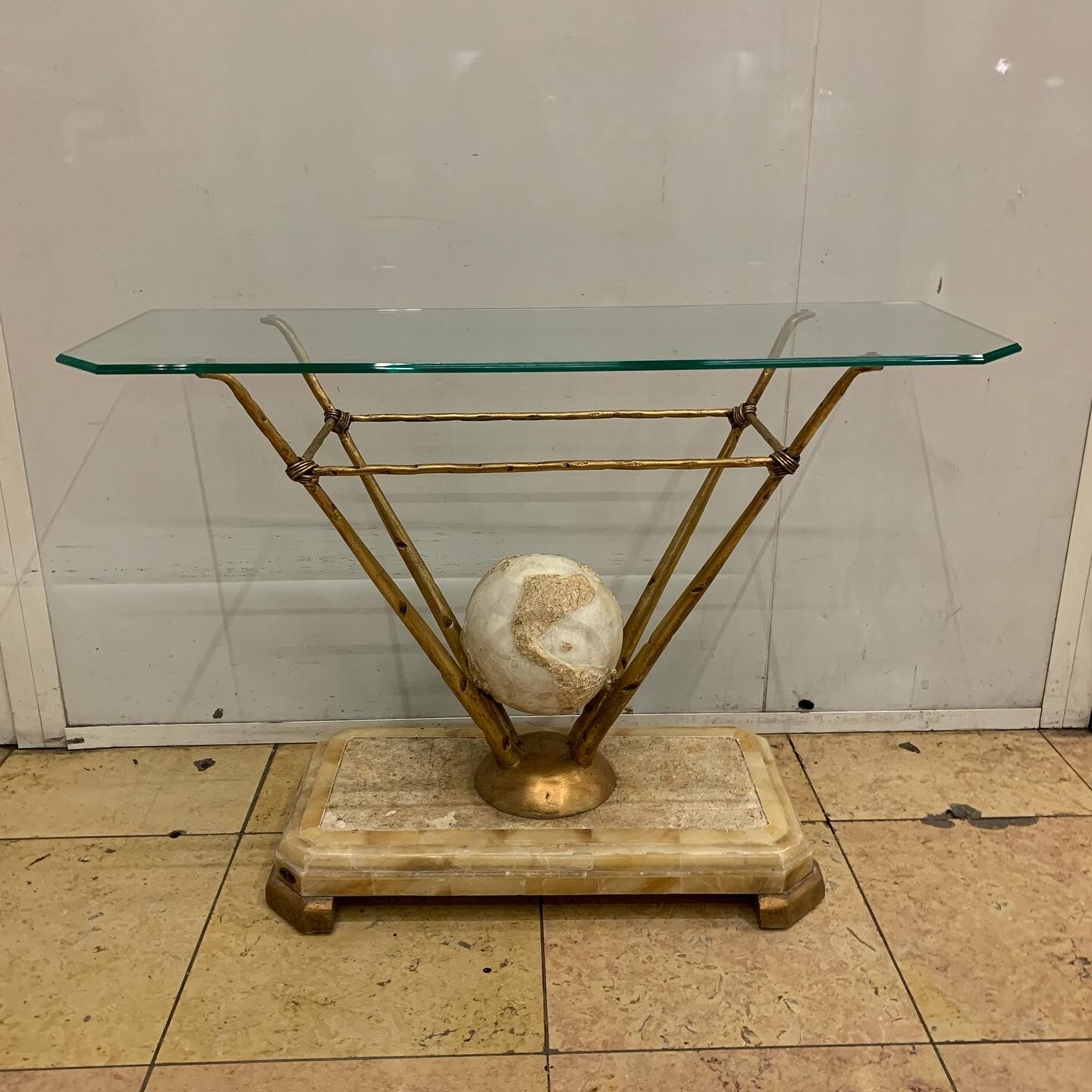 Travertine console from Fournier Paris over glass