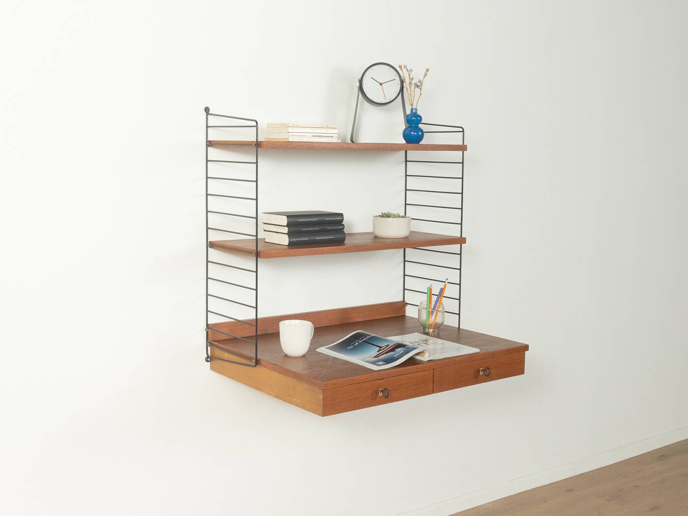 Original String shelf by Nils Strinning in teak veneer, 1949