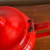 Red enamelled sheet metal teapot