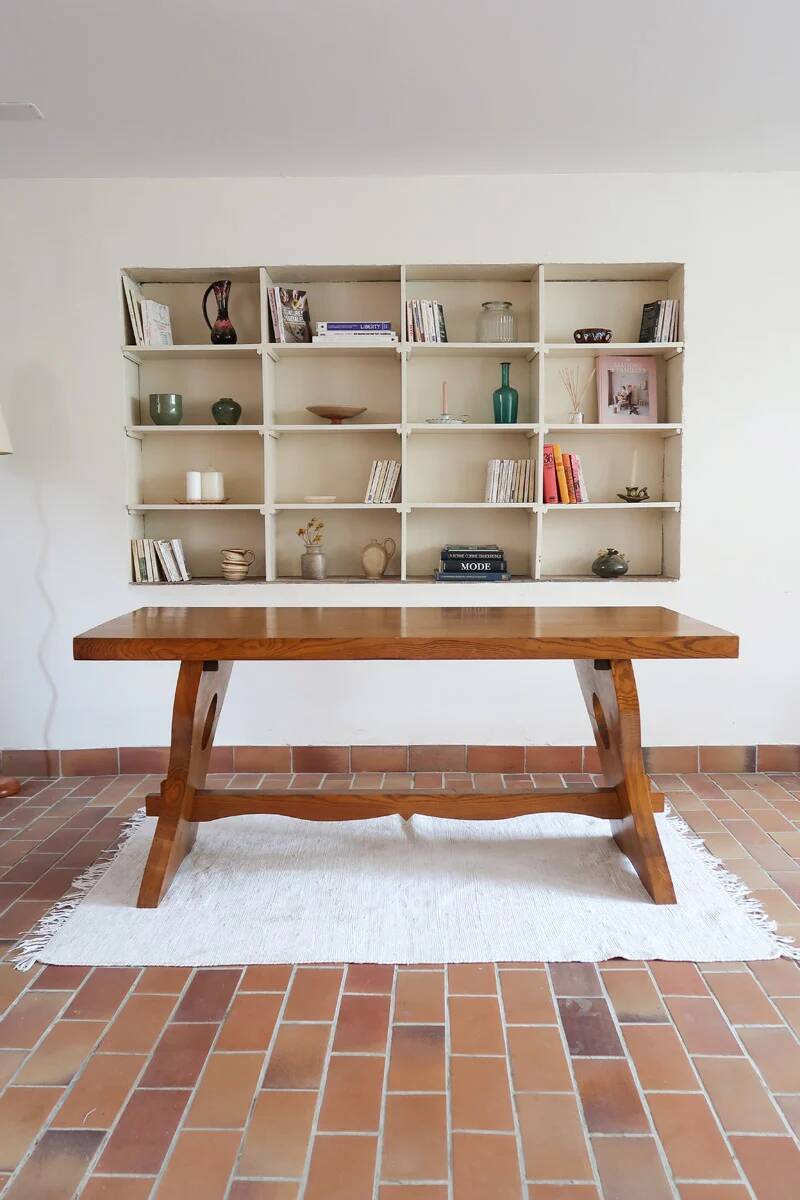 Solid wood dining table, sculpted brutalist base, 1960s.