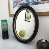 black and gold oval mirror