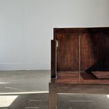 Small low armchair in varnished brown wood