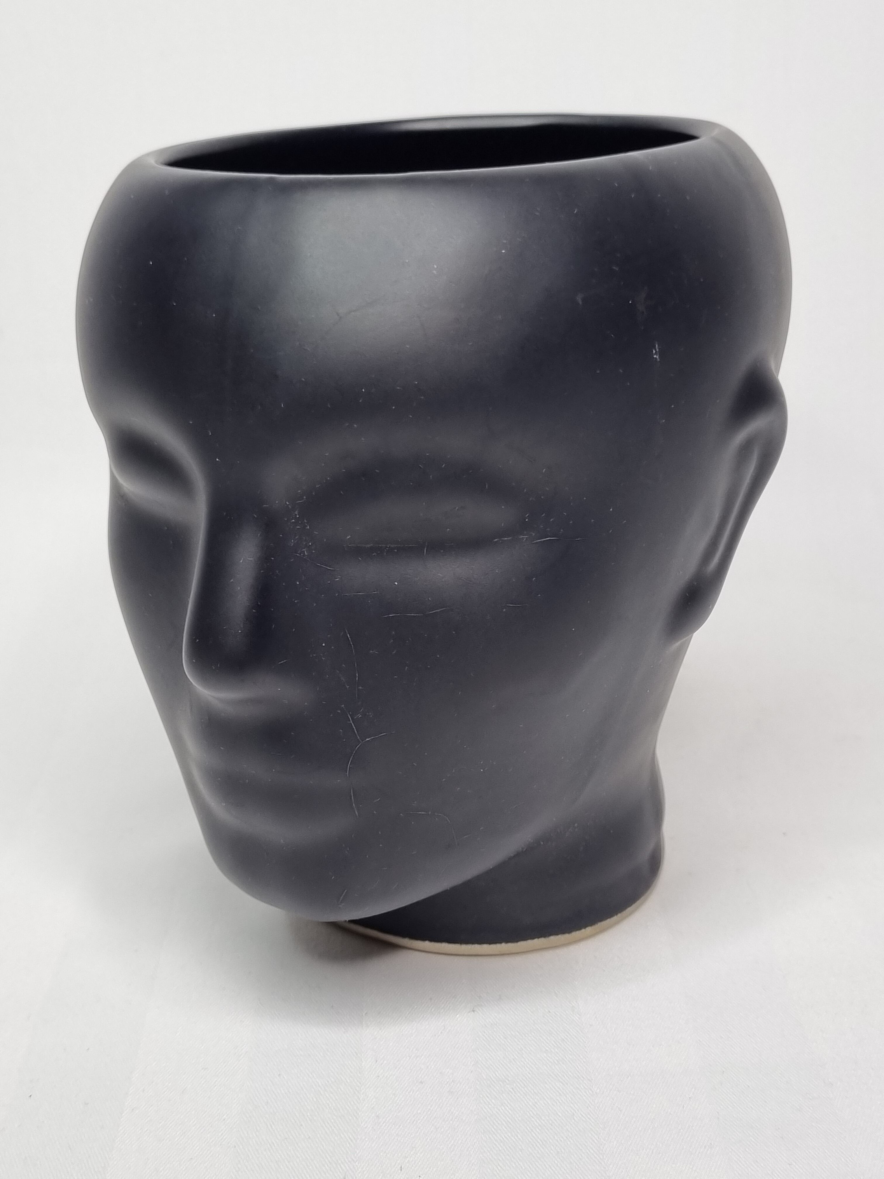 Anthropomorphic pot cover in matt black glazed ceramic, 80s