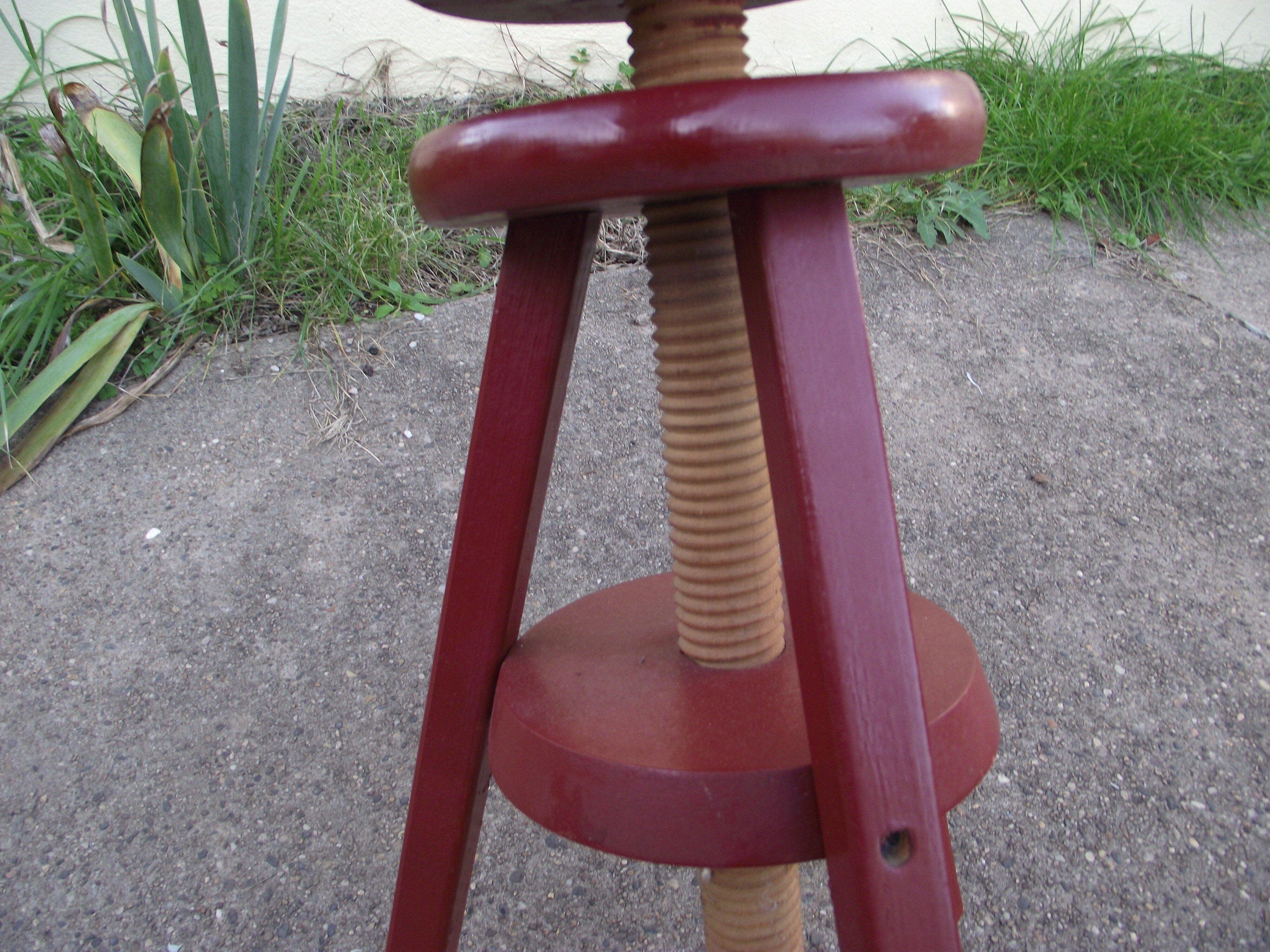 Wooden stool with high adjustable screw