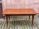 Scandinavian extendable dining table in lacquered wood and rosewood, 150cm.