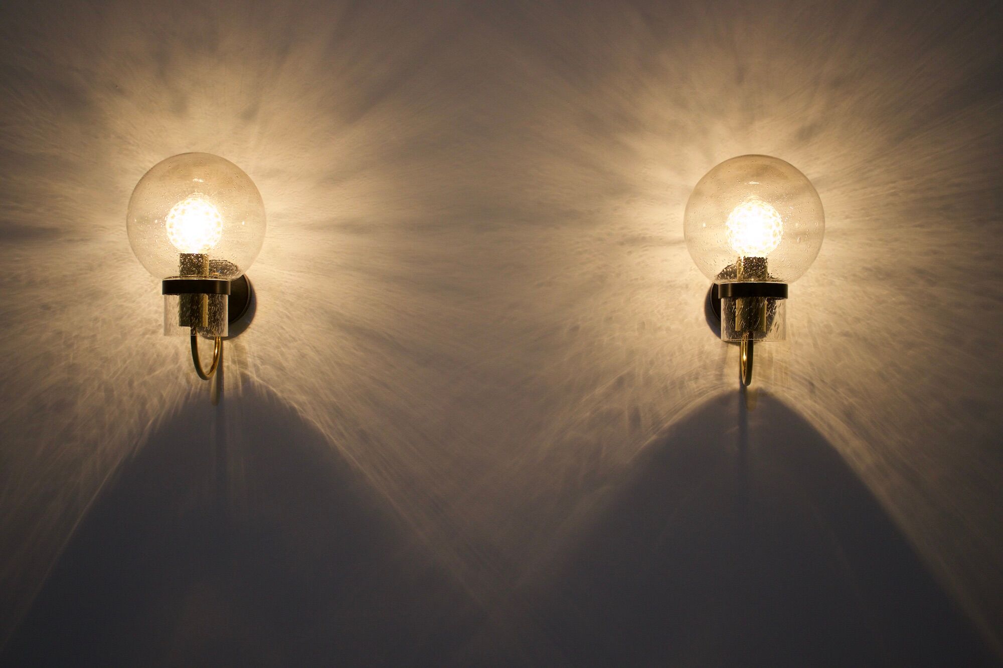 Wall lights with blown glass globes.