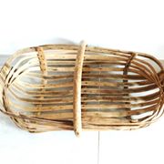 Old wooden harvest basket, slatted wooden basket, folk art.