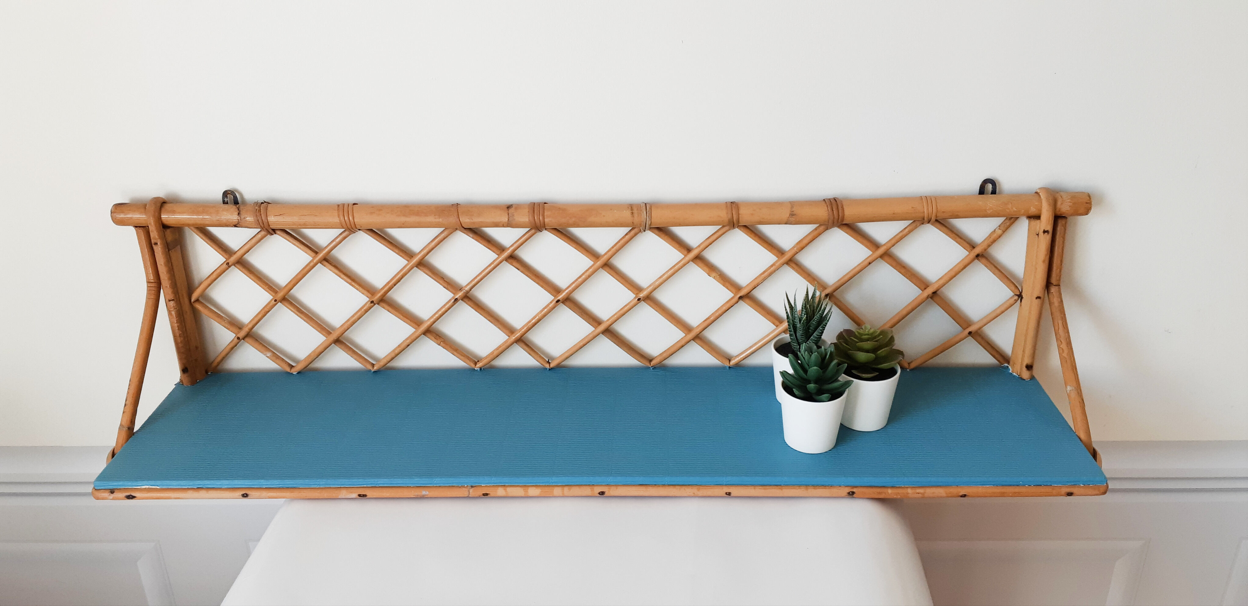 Blue rattan shelf